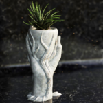 ашпа Дар - декоративен контейнер за растения с дизайн, вдъхновен от концепцията за дар, добавящ елегантност и символика